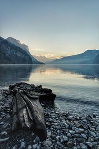 Scenic view of lake against sky during sunset