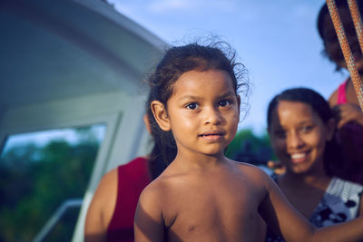 Portrait of shirtless girl outdoors