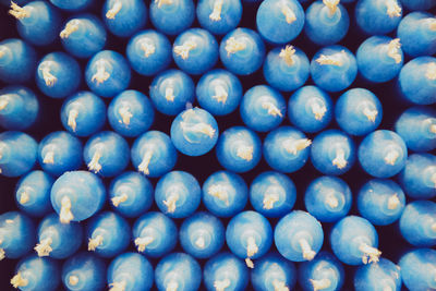 Stack of blue candles create a visual pattern