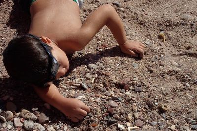Low section of boy on beach