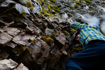 Low section of man on rock