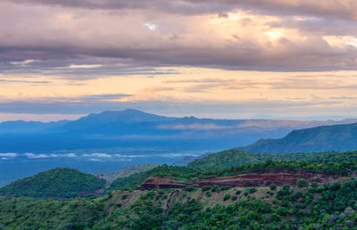 Scenic view of mountains against sky during sunset