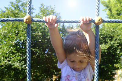 Close-up of girl playing at playground