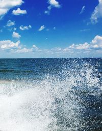 Scenic view of sea against blue sky