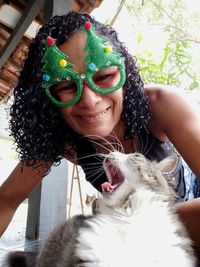 Portrait of happy woman with cat