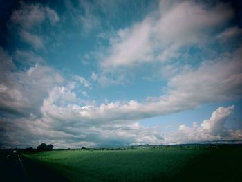 Scenic view of agricultural field against sky