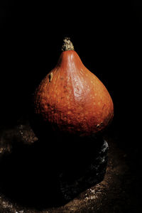 Close-up of pumpkin against black background