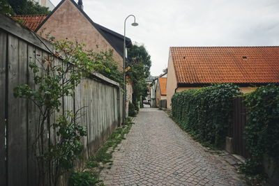 Street amidst buildings against sky