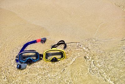 High angle view of shoes on sand