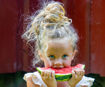 Close-up of girl eating food