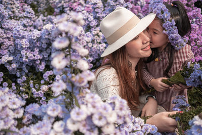 Mon and daughter walking in the margaret flower farm