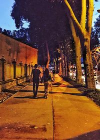 Woman walking on footpath