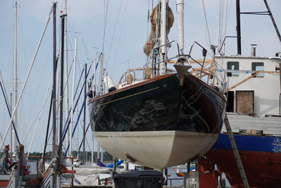 Boats moored at harbor