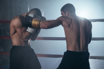 Fighters fighting in ring