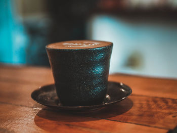 Close-up of coffee cup on table