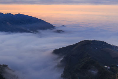 Scenic view of mountains against dramatic sky