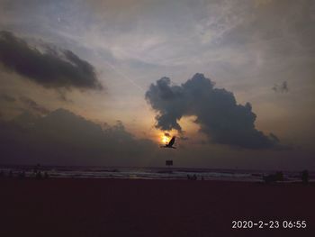 Scenic view of beach against sky during sunset