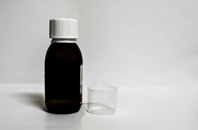 Close-up of empty glass bottle on table