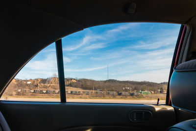 Cropped image of car on road