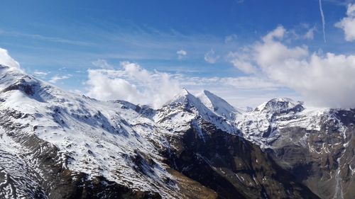 Scenic view of snowcapped mountains against sky