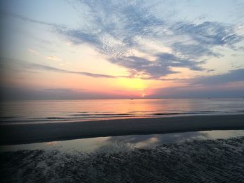 Scenic view of sea against sky at sunset