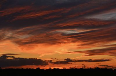 Low angle view of dramatic sky during sunset