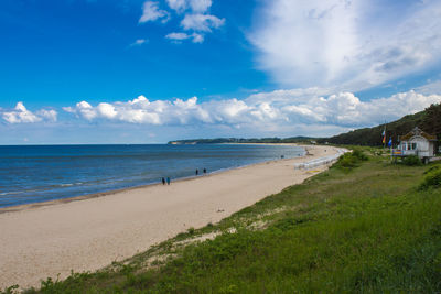 Scenic view of sea against blue sky