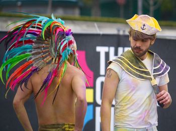 Men in apache and sailor costumes