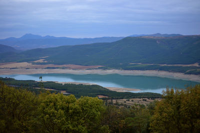 Scenic view of landscape and mountains against sky