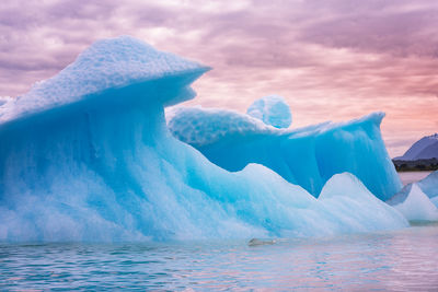 Scenic view of frozen lake against sky