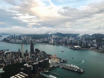 High angle view of bay and buildings against sky