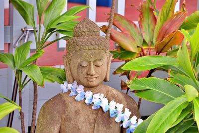 Close-up of statue against plants