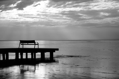 Pier on sea against sky