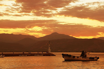 Scenic view of lake against dramatic sky