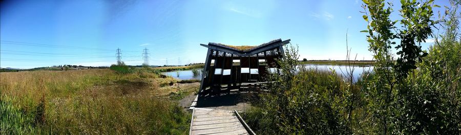 Built structure on field against sky