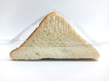 Close-up of bread against white background