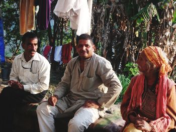 Group of people sitting outdoors