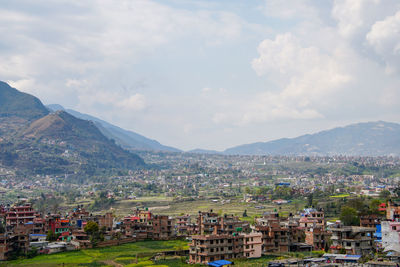 Aerial view of townscape against sky