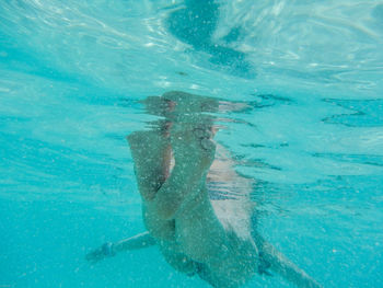 Man swimming in pool