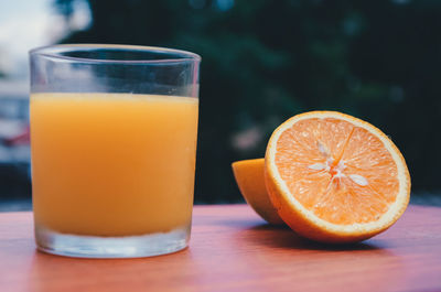 Close-up of orange juice on table