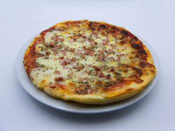 High angle view of pizza in plate on table