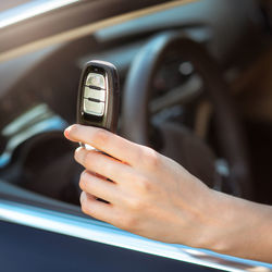 Close-up of hand holding car