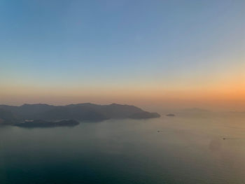 Scenic view of sea against clear sky during sunset