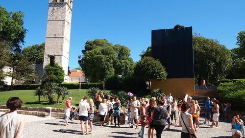 People at town square against clear sky