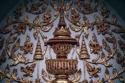 Low angle view of ornate ceiling in temple