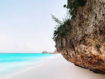 Scenic view of beach against clear sky