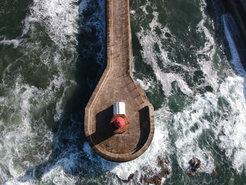 Directly above shot of rock in sea