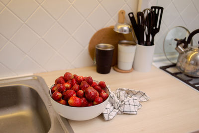 Close-up of strawberries in plate on table