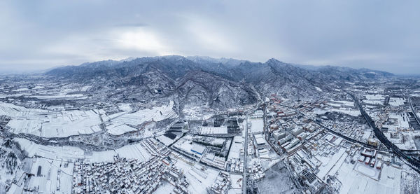 Aerial view of townscape against sky