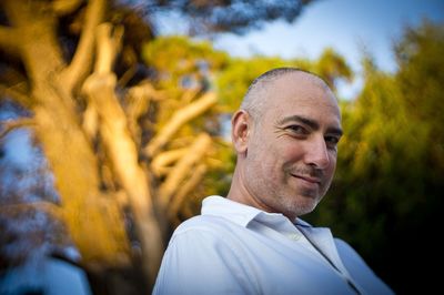 Portrait of smiling man against plants